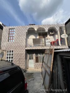 Parcelle incluant un bâtiment en étage R+1