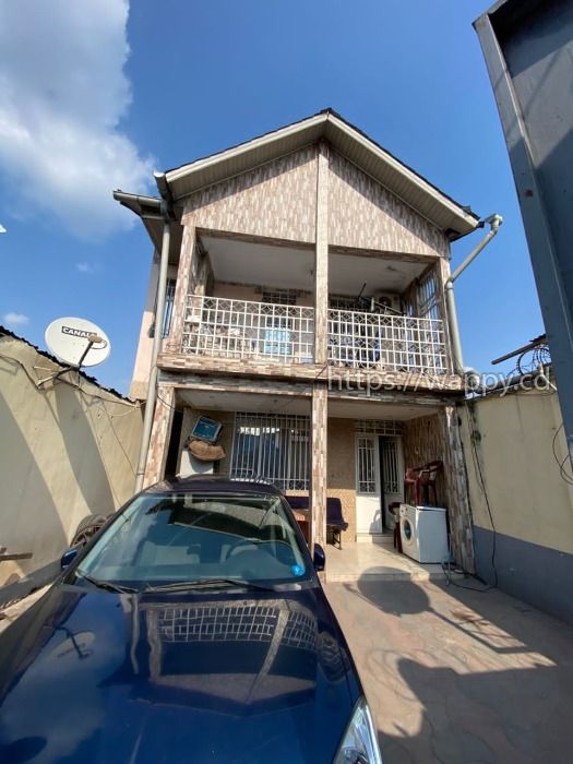 Parcelle dotée d'une maison en étage de R+1