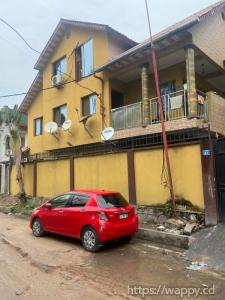 Parcelle dotée d'un bâtiment avec 4 appartements